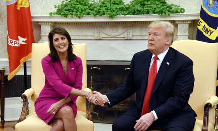 President Donald Trump shakes hands with Nikki Haley 700