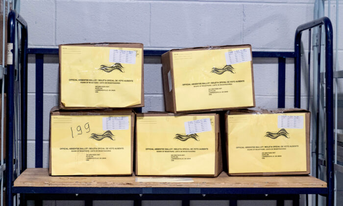 A recount of ballots in Georgia intended to determine the outcome of the 2020 Presidential election has come under scrutiny as multiple poll observers in sworn affidavits describe significant anomalies in the recount. The affidavits, under penalty of perjury, are part of an emergency motion filed on Nov. 17 in a bid to halt the certification of Georgia’s results for the Nov. 3, 2020, election. Observers in Fulton, DeKalb, and Cobb Counties—including an election official auditor, an election recount monitor, a credentialed statewide poll watcher, and several recount observers—raised their concerns in sworn affidavits under penalty of perjury, filed as Exhibits in the Georgia lawsuit brought by attorney L. Lin Wood Jr. Affidavit from Fulton County Georgia A screenshot of a spreadsheet filed by certified Fulton County recount observer Robin Hall as part of a Nov. 17, 2020, sworn affidavit. Hall said “many of the boxes of ballots had voted 100% for Biden and 0% for Trump.” (Screenshot/Epoch Times) A poll manager in the Sandy Springs precinct of Fulton County noted how she was provided a box of ballots on Saturday, Nov. 14, that had been shut with packing tape bearing the seal of the Secretary of State. But “the seal was blank, signed by no one, and no information had been supplied,” she testified. Nor was there any designation detailing the origin of the box or its contents. Inside the box were stacks of ballots, each stack containing approximately 100 ballets each. The poll manager noted that while most of the ballots showed obvious signs of handling, one batch “stood out” for their “pristine” condition. The poll manager, who had 20 years of experience in that role, noted that in regards to this batch of ballots, “There was a difference in the texture of the paper—it was if they were intended for absentee use but had not been used for that purposes. There was a difference in the feel.” She also observed a “slight depressed pre-fold so they could be easily folded and unfolded for use in the scanning machines.” There were no markings on the ballots that showed their origin or where they had been processed. In her words, these ballots “stood out.” These particular ballots contained markings for the candidates that were “unusually uniform, perhaps even with a ballot-marking device.” According to her estimate, approximately 98 percent of these ballots were votes for former Vice President Joe Biden, with only two ballots constituting votes for President Donald Trump. At the end of her sworn statement, the poll manager stated her belief that “additional absentee ballots had been added in a fraudulent manner.” The poll manager left that day at 4:45 pm. She noted in her sworn remarks that she asked a guard what his hours of duty extended to. He told her that he would be present until 11:00 p.m., at which point a new shift would arrive to cover the hours of 11:00 p.m. to 7:00 a.m.—matching the time at which the poll manager was scheduled to return. The following day, Sunday, Nov. 15, upon arriving, the poll manager was struck by how few auditors were present on that day’s count. At this point, the poll manager began to notice a disparity in workloads being assigned. Surrounding tables, whose occupants had arrived after the poll manager, began receiving large boxes of ballots. Forty-five minutes later, when the poll manager’s table was finally provided ballots, their box contained only 60 ballots. According to the poll manager, other auditing tables received boxes “with over 3,000 ballots each.” When the poll manager’s table finished with the small box of ballots, they were told their assistance was no longer required and were instructed to “go home.” Offers to assist the other tables with their much larger number of ballots were refused by site officials. The poll manager noted that she elected to stay at her table for a bit and observe the nearby auditors as they worked. Although she had been explicitly told that no food or drink would be allowed on the table, she noted that individuals behind and in front of her had “open water bottles, breakfast burritos supplied by the BOE [Fulton County Board of Elections] and snacks on their tables.” Notably, she observed that the individuals at these tables were not counting ballots in a team fashion—a process used to ensure accuracy of each ballot count. Instead each auditor was “counting individually.” The poll manager noted that this individualized recount process was “consistent with the lack of preparation, contingency plans, and proper procedures” that she experienced “in this unusual election.” Late Delivery & Unsecured Ballot Marking Devices The poll manager then provided a noteworthy example of the lack of proper procedures on Election Day itself. According to the poll manager, ballot marking devices are supposed to be received “on the Friday before the election, with a chain of custody letter to be signed on Sunday, indicating that we had received the machines and counts on the machines when received, and that the machines had been sealed.” However, during this election, the poll watcher stated that the “machines were not delivered until 2:00 a.m. in the morning on Election Day.” She noted that this delivery process was “unacceptable and voting machines should not be out of custody immediately prior to an Election Day.” As she stated, “It is possible that these ballot marking devices could have been used for other purposes during that period.” The affidavit did not detail what these purposes might have been. To make matters worse, when the machines did arrive at her precinct, they were remarkable in their lack of secured status. As she documented in her sworn statement, the machines “were not sealed or locked, the serial numbers were not what were reflected on the related documentation, and the green bar coded tags that are supposed to cover the door covering the memory card was broken.” The poll manager stated that although her supervisor instructed her to use the machines, she knew this was outside of standard procedures and refused to place the machines into service. Other Problems Observed Georgia A Gwinnett county worker raises a piece of paper indicating she has a question as the recount of ballots begins in Lawrenceville, Ga., on Nov. 13, 2020. (Megan Varner/Getty Images) The observations of the poll manager are borne out by sworn statements from others involved in the Georgia recount. An observer at the Cobb County Poll Precinct, who is a Democrat and licensed paralegal, noted how she observed poll workers counting the ballots in silence, not verifying the names aloud. Additionally, she described unusual sets of ballots similar to those described by the poll manager. In sworn testimony, she said that “hundreds of these ballots seemed impeccable, with no folds or creases. The bubble selections were perfectly made (all within the circle), only observed sections in black ink, and all happened to be selections for Biden.” This observer also stated that “signatures were not being verified” and there “were no corresponding envelopes seen in site.” She concluded her sworn statement by noting, “I believe there was fraud committed in the presidential election and question the validity of the Georgia recount process.” Another poll observer, a Democrat and Florida trial lawyer, traveled as an observer to the Dekalb County Poll Precinct. In his sworn statement, this observer noticed ballots with two distinct characteristics: “they all had a perfect black bubble and all were Biden select.” The observer stated that as workers went through the ballots, Biden’s name was called “over 500 times in a row.” The following day, this same observer went to the Cobb County Poll Precinct where he again noted the same ballot characteristics: “they were all for Biden and had the same perfect black bubble.” The observer stated that he saw “absentee ballots for Trump inserted into Biden’s stack and were counted as Biden votes.” He stated that during three days spent in Atlanta, “not once did anyone verify signatures on these ballots.” The observer concluded his testimony by stating: “in the counties that I have observed, there is widespread fraud favoring candidate Biden only. There were thousands of ballots that just had the perfect bubble marked for Biden and no markings in the rest of the ballot.” Another witness, an election recount monitor at the Georgia World Congress Center, stated that he observed “large quantities of ballots being cast for Joe Biden on ballots that did not appear to have been mailed.” As he stated, “there were no creases in the mail-in ballots giving the impression that they were never folded into an envelope and mailed.” In particular, this recount monitor stated that these ballots “appeared to be pre-printed with the selections already made.” He noted that “hundreds of ballots at a time were counted for Biden only.” Boxes of Ballots for Biden, Zero for Trump Another certified Fulton County recount observer stated that during their observation process, “many of the boxes of ballots had voted 100% for Biden and 0% for Trump.” Similar to other observers, this one stated that the “ballots appeared to be perfectly filled out as if they were pre-printed with the presidential candidate selected.” This observer stated that they, along with other observers, were disturbed enough to write down “which batch headers and box number ranges were suspicious” and went so far as to create a spreadsheet with a listing of the batch numbers. A handwritten note on the side of the spreadsheet states, “All questionable ballots. Looked machine stamped. 95-100% Biden for most of them.” Another election official auditor at the Georgia World Congress Center stated in a sworn statement that she observed the same pristine condition of ballots, noting the “absentee ballots looked as though they had just come from a fresh stack. I could not observe any creases in the ballots and did not seem like they were ever folded and put into envelopes or mailed out.” Like the other observers, these ballots contained “perfectly bubbled markings for Biden.” Military and Overseas Ballots Another observer stated that all the military and overseas ballots that she reviewed were “very clean” and were “marked in black ink” and that “many batches went 100% for Biden.” The observer also noted that “the watermark on at least three ballots were solid gray instead of transparent,” which led the observer to state her belief that these ballots were “counterfeit.” This matter was brought directly to the elections director who told the observer that the ballots were legitimate and the difference in markings was due to the “use of different printers.” This observer also noted that “many ballots had markings for Biden only, and no markings on the rest of the ballot.” She stated that none of the Trump ballots were marked in the same fashion. Lastly, this observer noted that the military ballots did “not have one specific precinct code on them” but instead had “multiple precincts printed” on them. The observer stated this created a situation where it was impossible to know which precinct the voter was registered in. She closed by stating her belief, based on her observations coupled with the lack of signature verification, that “the military ballots are highly suspicious of fraud.”