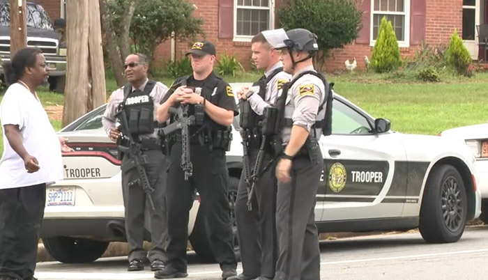 Student injured in North Carolina high school shooting, suspect on the loose.