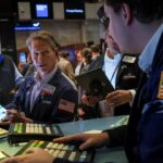 Dow Opens Higher on Easing China COVID-19 Curbs; Tesla Weighs on Nasdaq