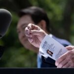 President Biden Holds Note With Reporter’s Question Before Calling on Her