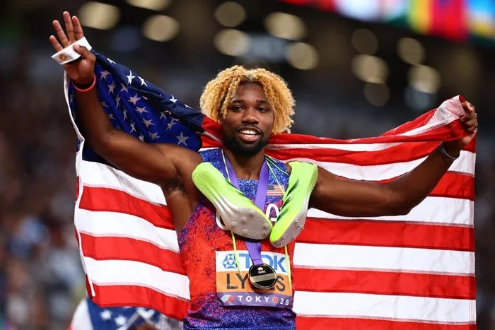 Lyles Surges Late to Win Fourth Successive 200m Gold jpg